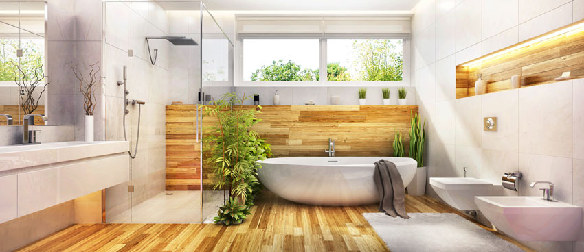 Salle de bains avec ameublement moderne, baignoire, cabine de douche et meubles muraux.