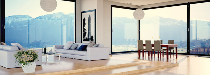 Salon contemporain avec grandes fenêtres, décor minimaliste.