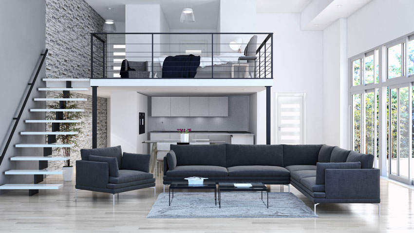 Un beau salon avec chambre mansardée, canapé d'angle noir moderne.